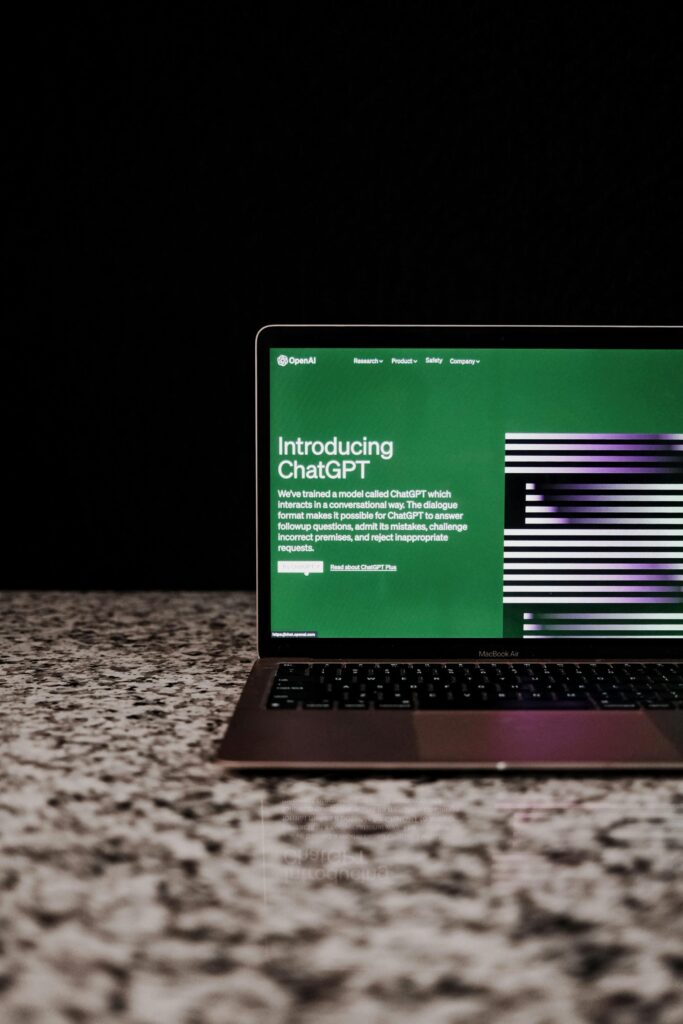 Laptop screen displaying chatgpt.ai homepage on a carpet, used for AI content generation